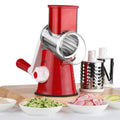 Manual vegetable chopper with suction base in blue slicing potatoes and carrots