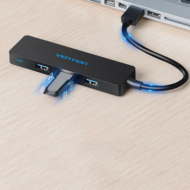 Black USB 3.0 hub with four ports and a short 0.15 metre cable