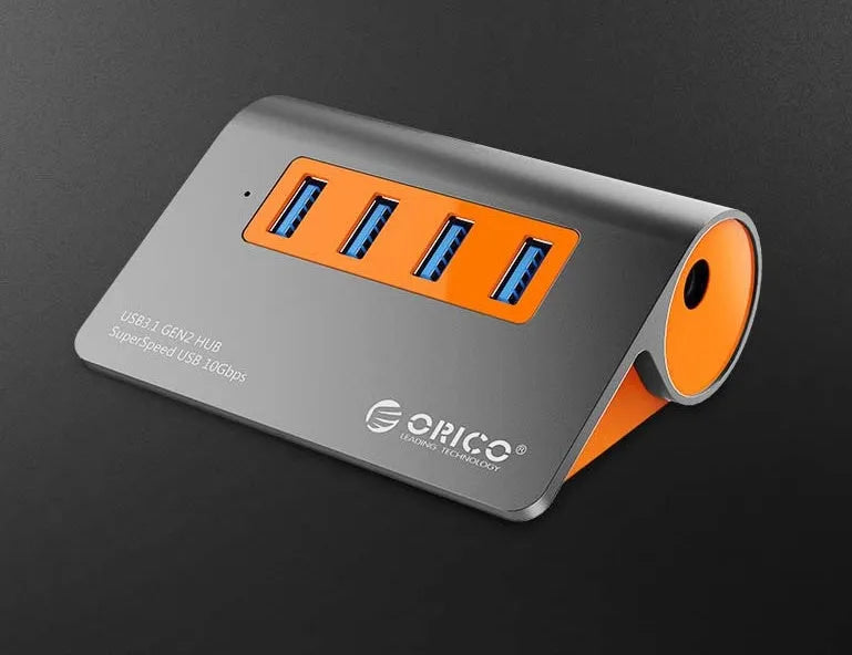 Dark grey and orange aluminium USB 3.1 hub with four ports and detachable cable