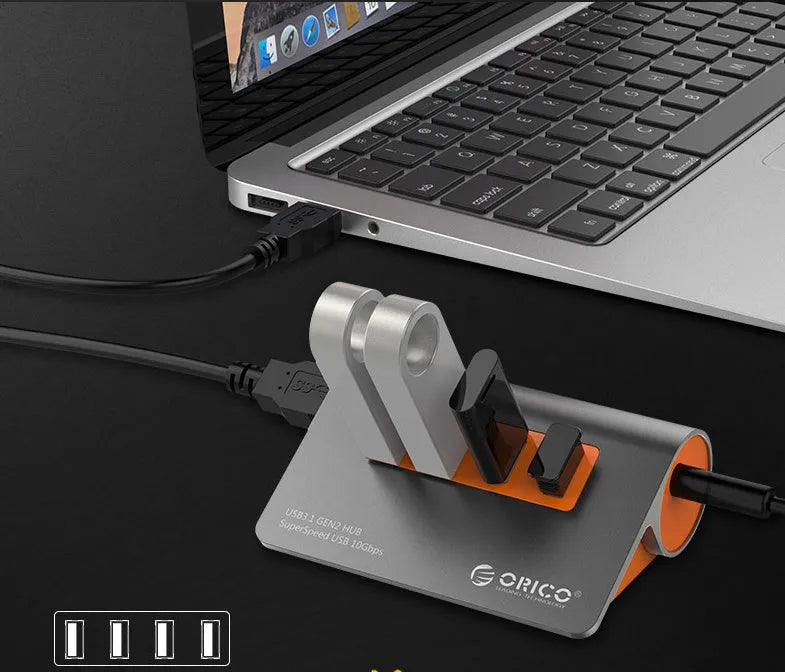 Dark grey and orange aluminium USB 3.1 hub with four ports and detachable cable