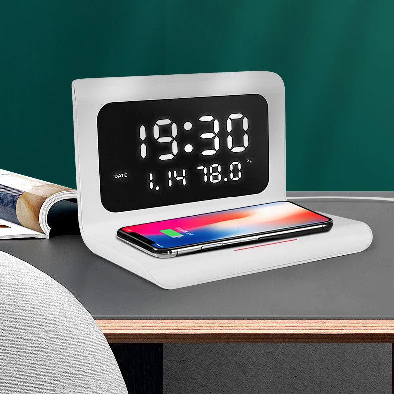 White wireless charging alarm clock with digital display showing time, date, temperature and humidity readings