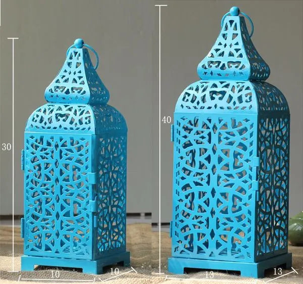 Geometric hollow iron candlestick in blue, white, or yellow, shown as a pair.