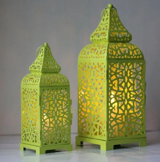 Geometric hollow iron candlestick in blue, white, or yellow, shown as a pair.