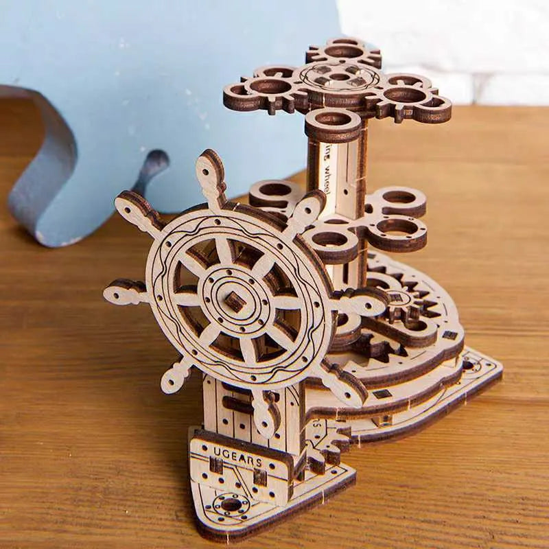 Ukrainian wooden rotating pen holder with steering wheel mechanism on natural wood desk