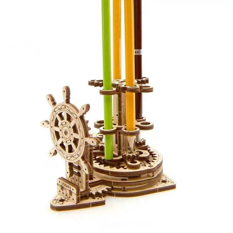 Ukrainian wooden rotating pen holder with steering wheel mechanism on natural wood desk