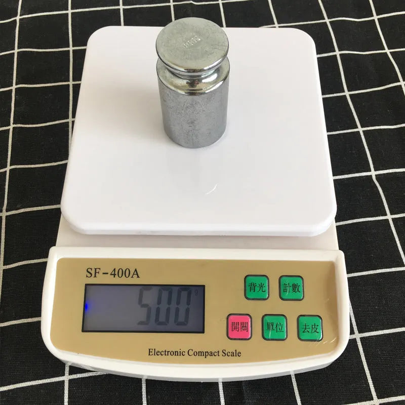 SF-400A digital kitchen scale on counter with 10kg capacity and clear display showing weight measurement
