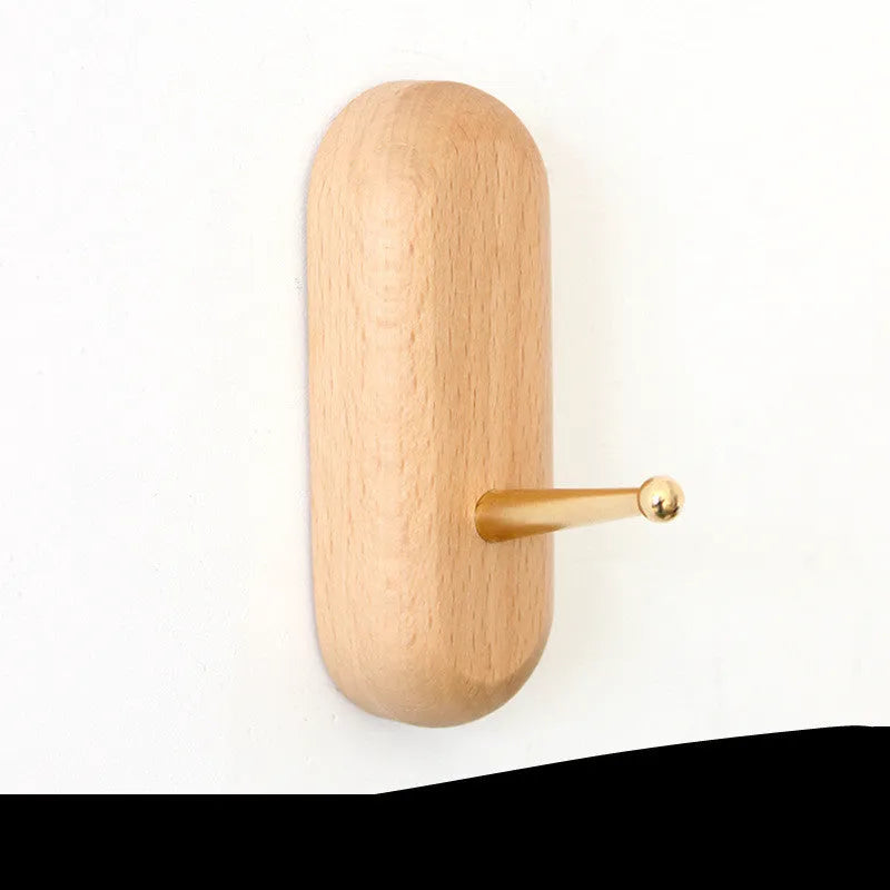 A natural beech wood adhesive wall hook in a simple single hook design, shown alongside other shape variants.