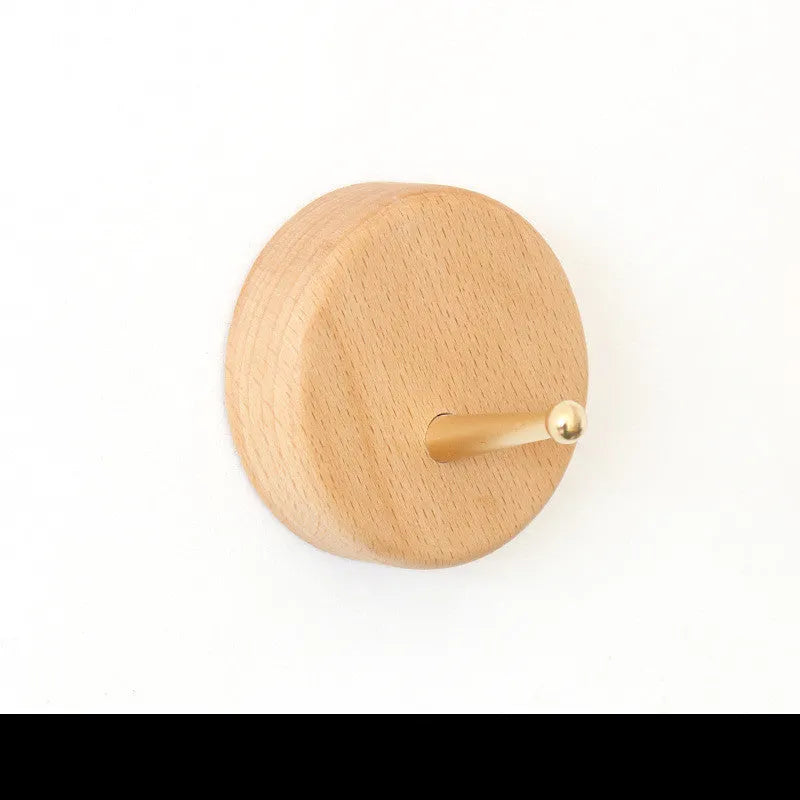A natural beech wood adhesive wall hook in a simple single hook design, shown alongside other shape variants.