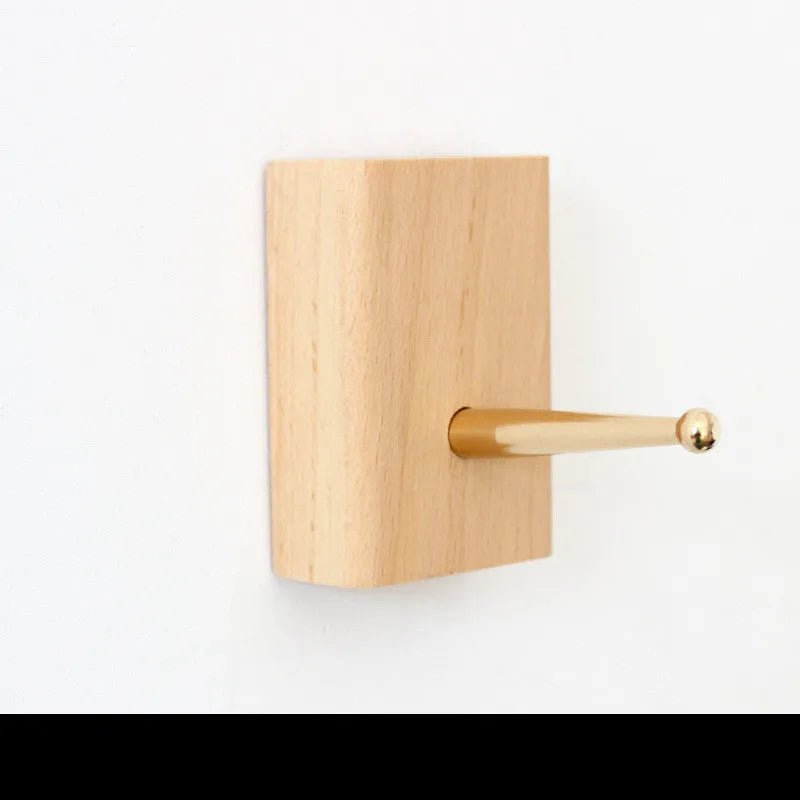 A natural beech wood adhesive wall hook in a simple single hook design, shown alongside other shape variants.
