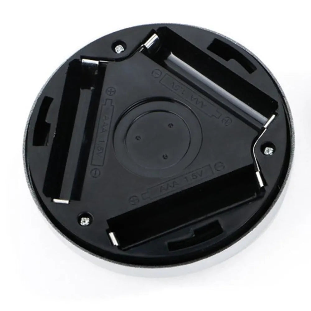 Silver wireless motion sensor night light with circular design and LED illumination