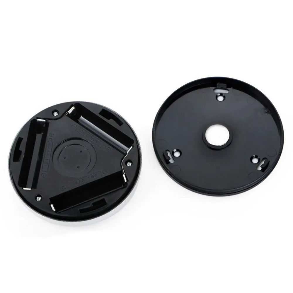 Silver wireless motion sensor night light with circular design and LED illumination