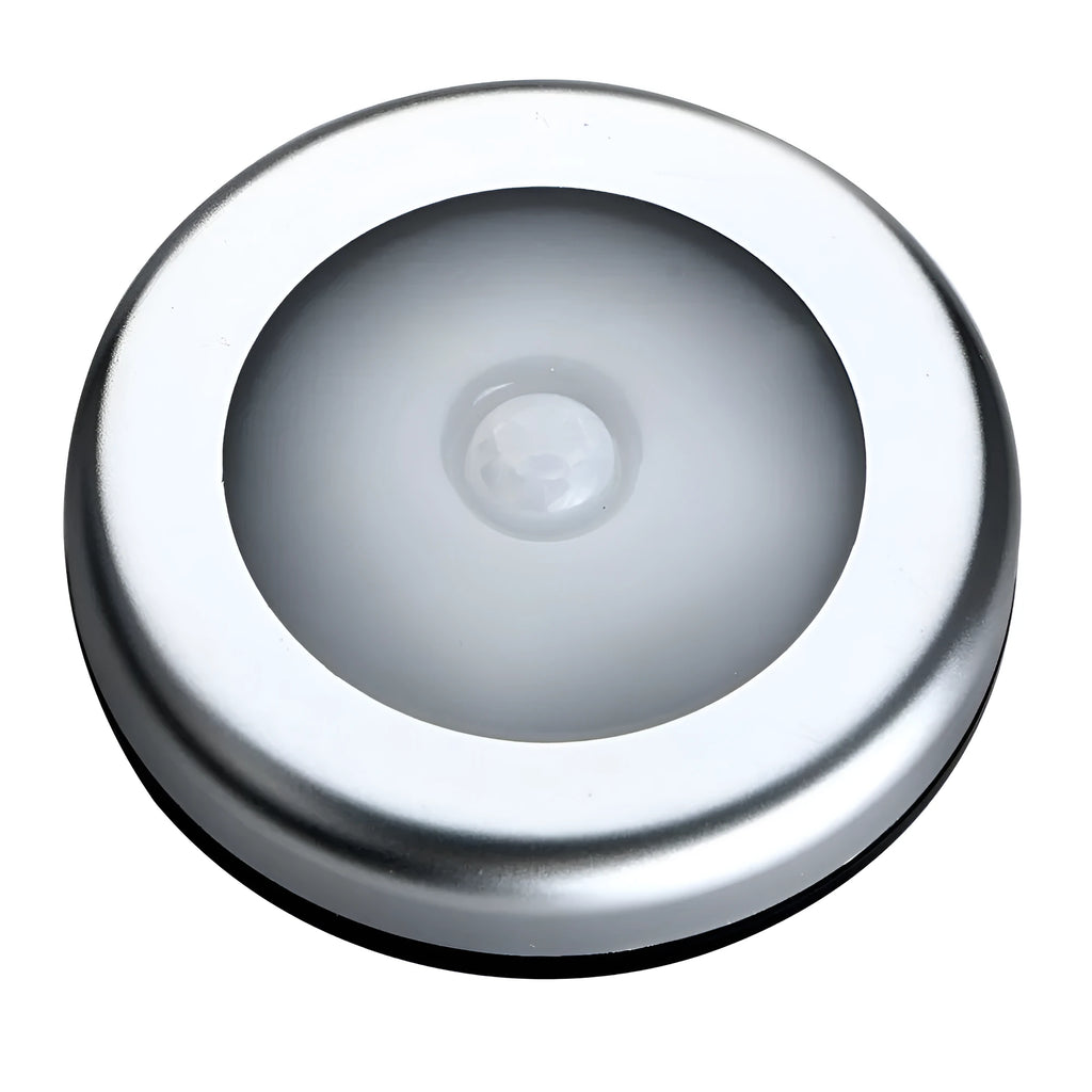 Silver wireless motion sensor night light with circular design and LED illumination