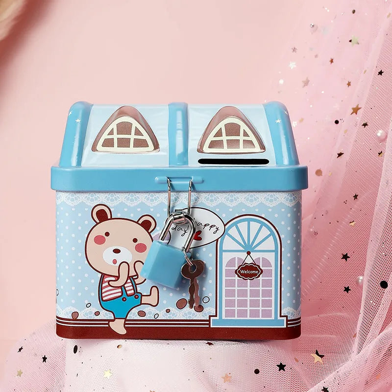 Blue house-shaped tinplate piggy bank for coin storage on desktop