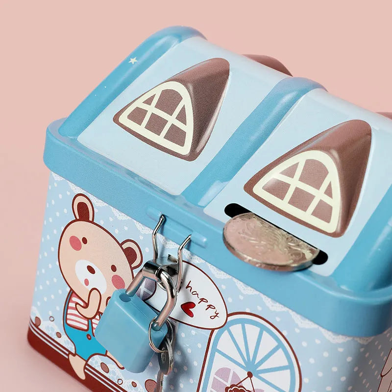 Blue house-shaped tinplate piggy bank for coin storage on desktop