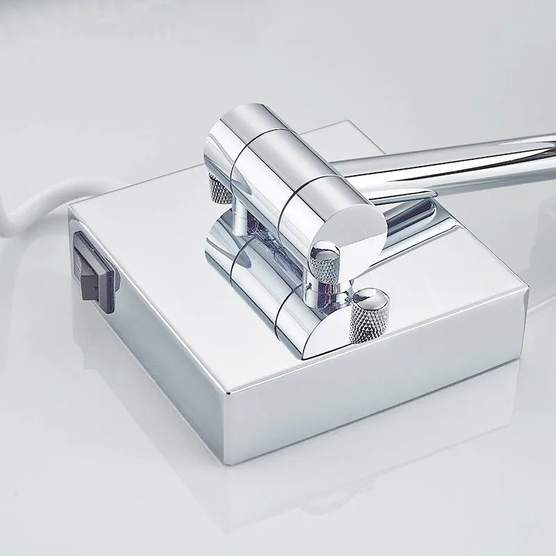 Stainless steel folding makeup mirror with a large silver mirror lens on a flat surface.