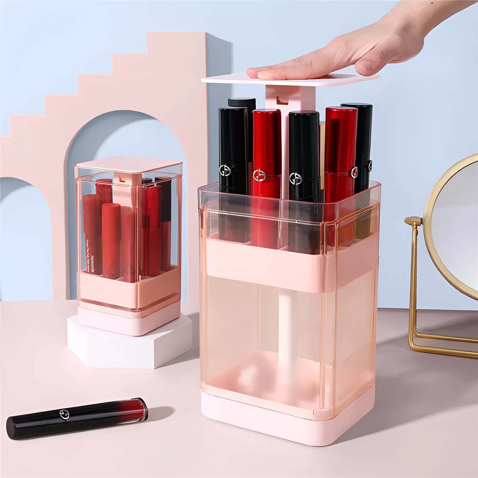 Press lift lipstick storage box in pink or white, showing dust-proof cover and internal grid compartments for organisation.