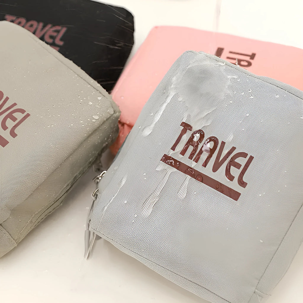 Cube-shaped sealable travel storage bag in black, grey, khaki, or pink.