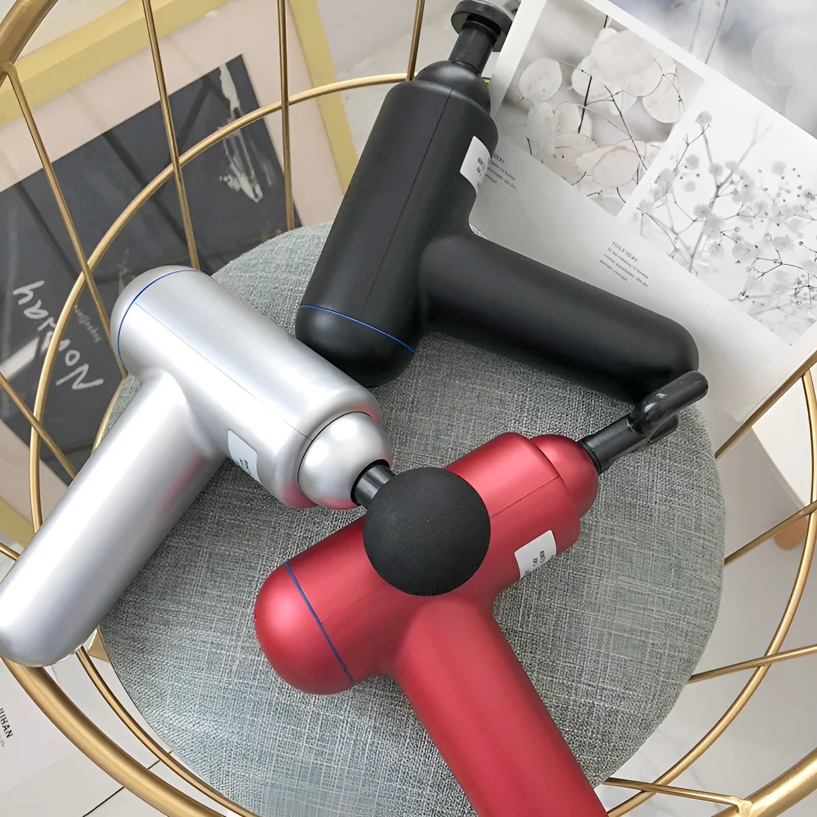 Fascia gun muscle massager in black, red or white colours with USB charging port