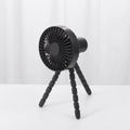 Compact portable desktop fan with flexible tripod stand and bending head, shown in white colour on a desk.