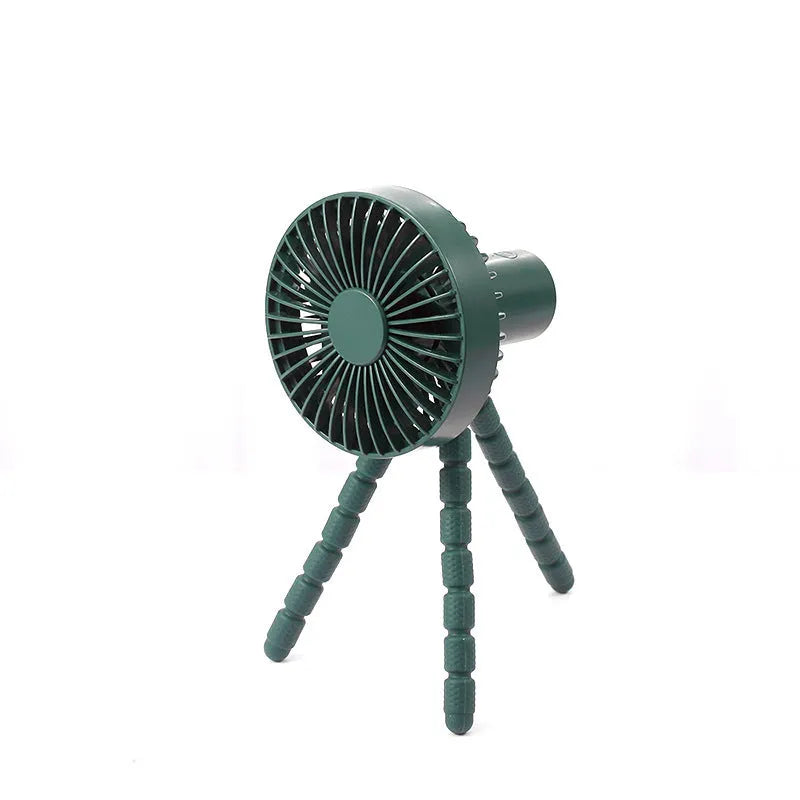 Compact portable desktop fan with flexible tripod stand and bending head, shown in white colour on a desk.