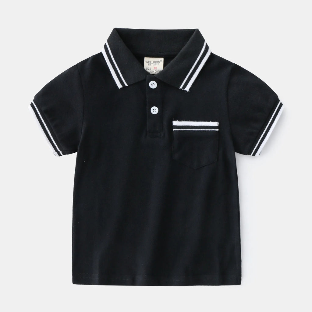 White and black boys' short sleeve cotton polo shirt laid flat.