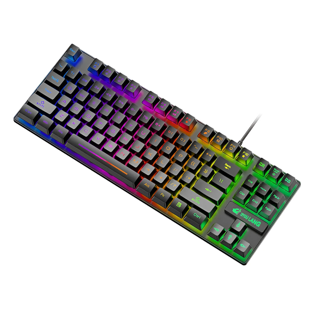Compact mechanical gaming keyboard with RGB lighting next to laptop