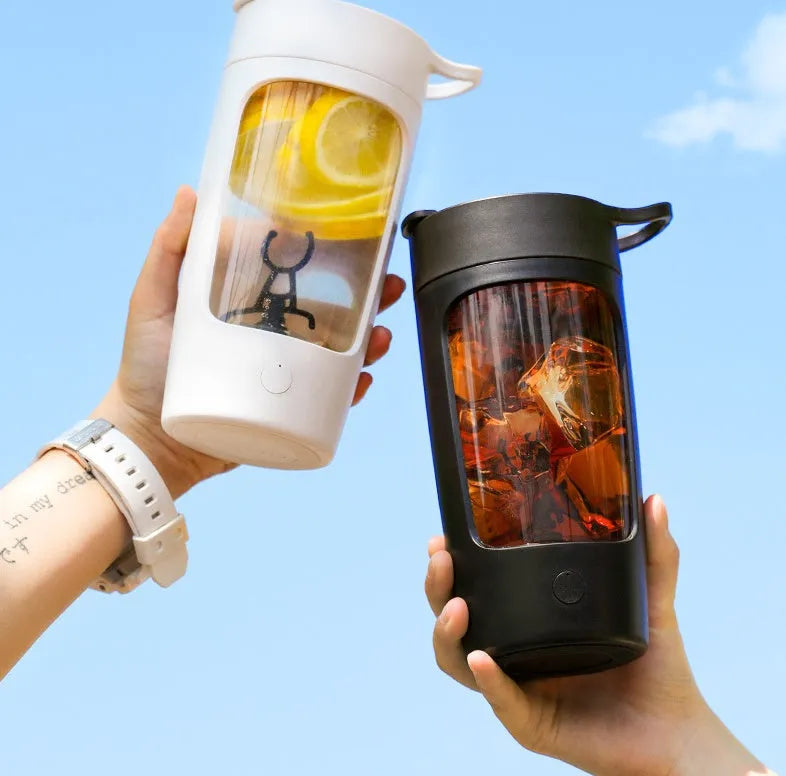 Portable automatic blending cup in chosen colour, showing measuring lid and compact size.