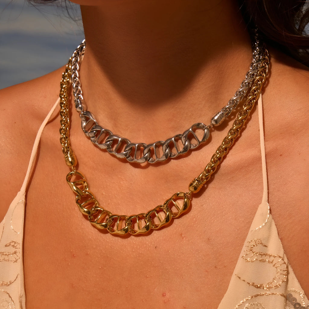 Gold plated stainless steel geometric pendant necklace for women on a chain.