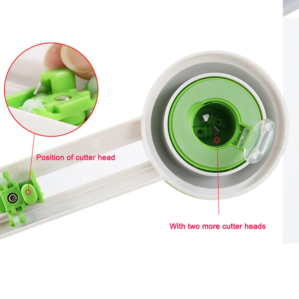 Green and orange plastic A3 round paper cutter on a colour box.
