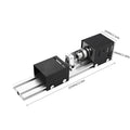 Silver metal mini manual woodworking lathe on a benchtop with carving tools