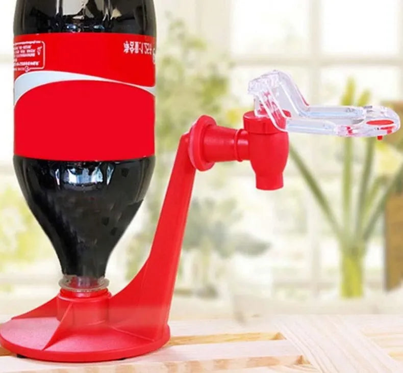 Red plastic Magic Tap soda bottle dispenser with push-button tap for 2-litre bottles.