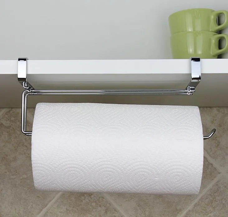 Silver stainless steel paper towel rack mounted on a cabinet door.