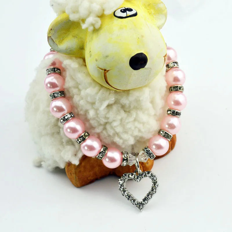 Pet pearl necklace with 10mm imitation pearls, 7mm rhinestone beads, alloy pendant, and white plated K detail