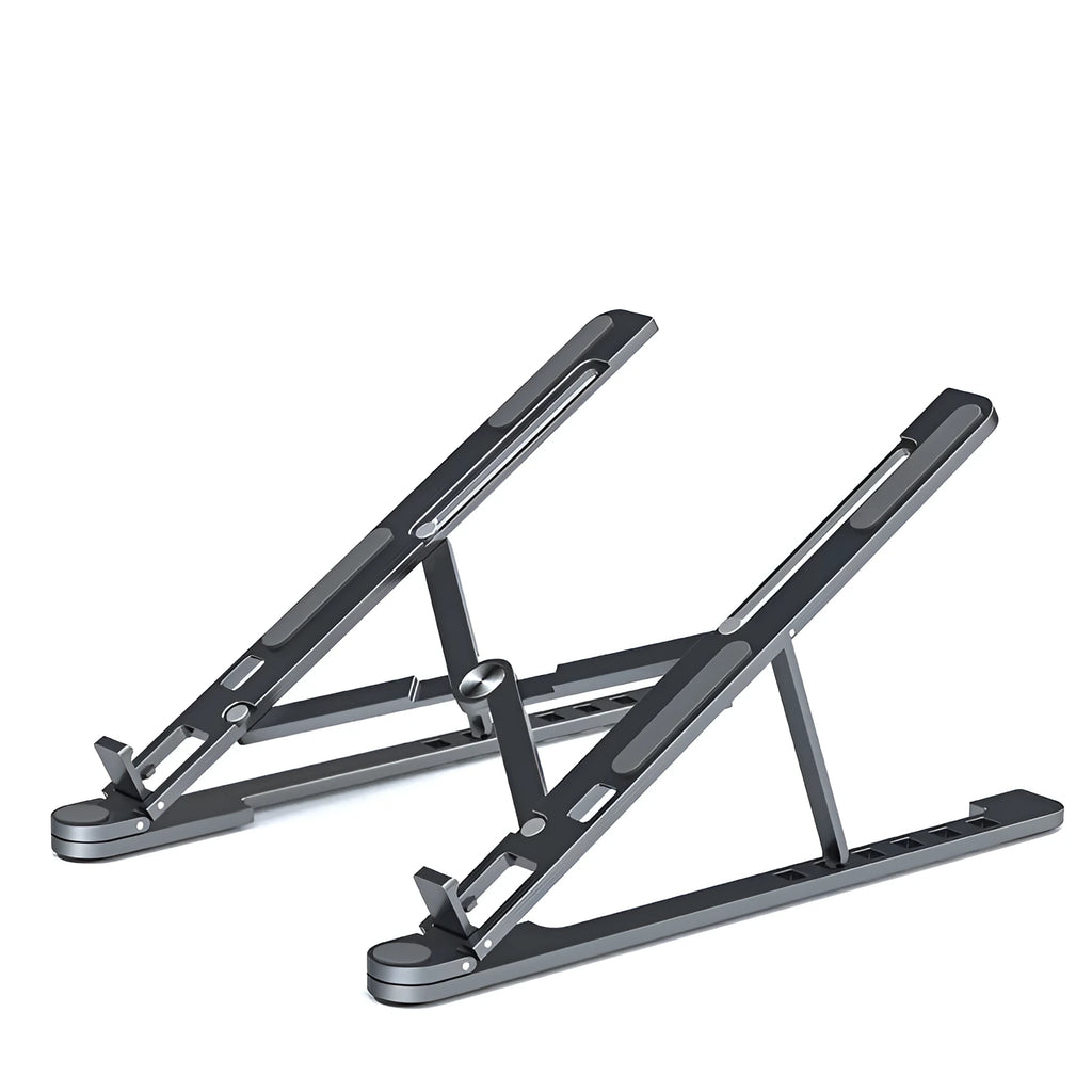 Aluminum alloy laptop stand in silver colour, folded to show its slim profile next to a 15-inch laptop.