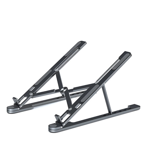 Aluminum alloy laptop stand in silver colour, folded to show its slim profile next to a 15-inch laptop.