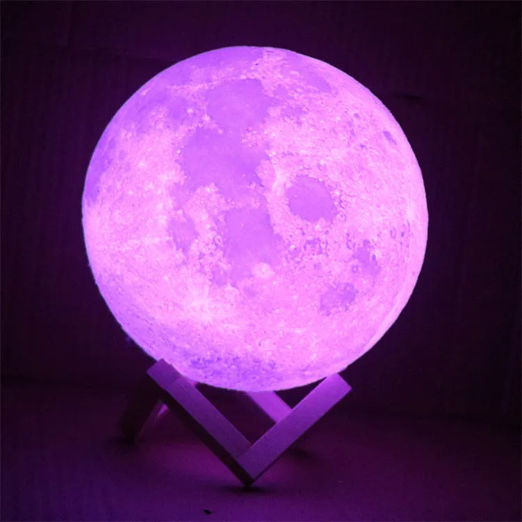 3D printed moon light lamp on wooden stand with detailed lunar surface, showing touch ring at base.