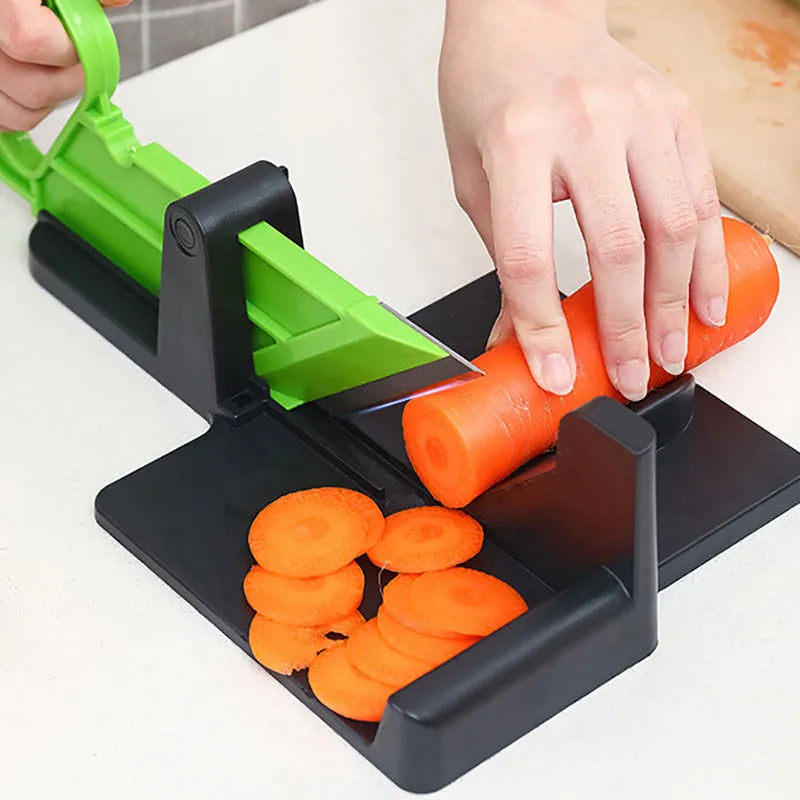 Green and red plastic vegetable cutter with stainless steel blades for slicing carrots and potatoes.