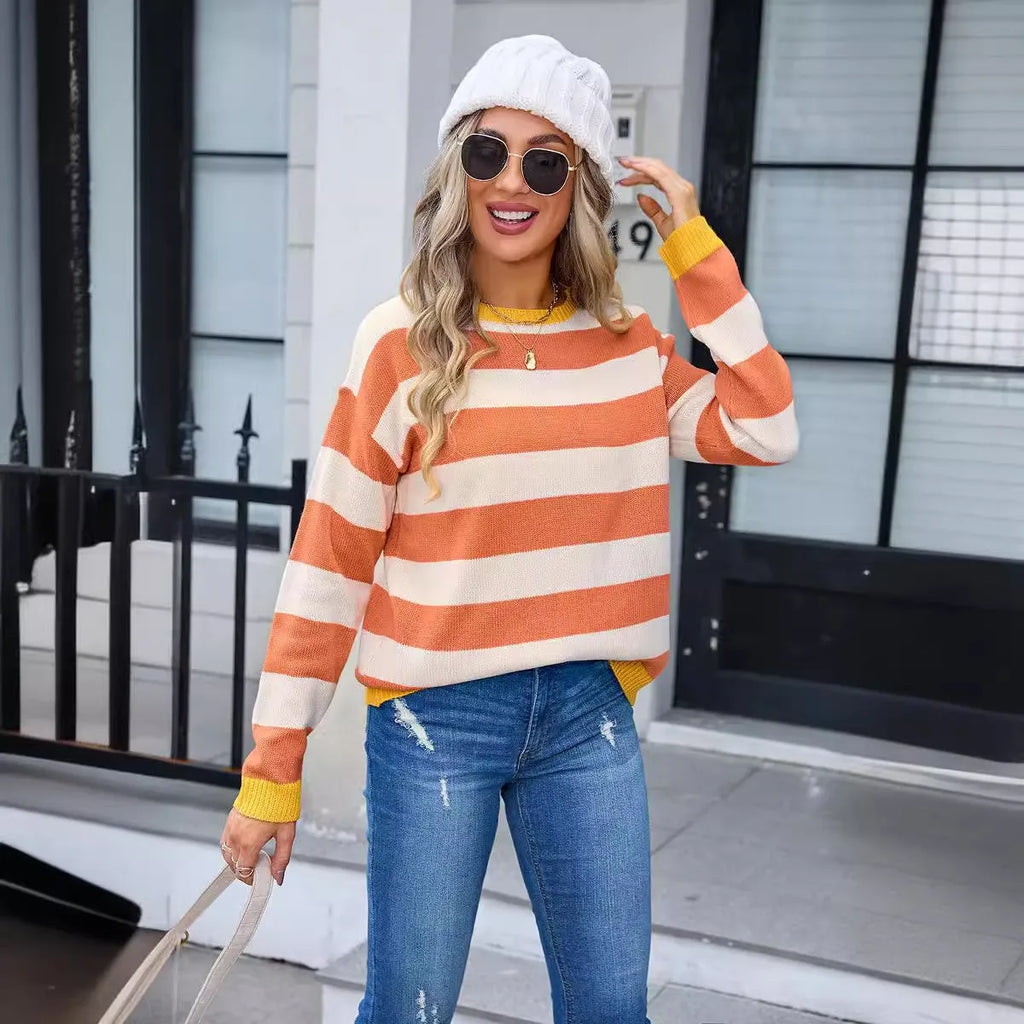 Women's loose long sleeve sweater in a striped pattern, shown in a blue colour option.