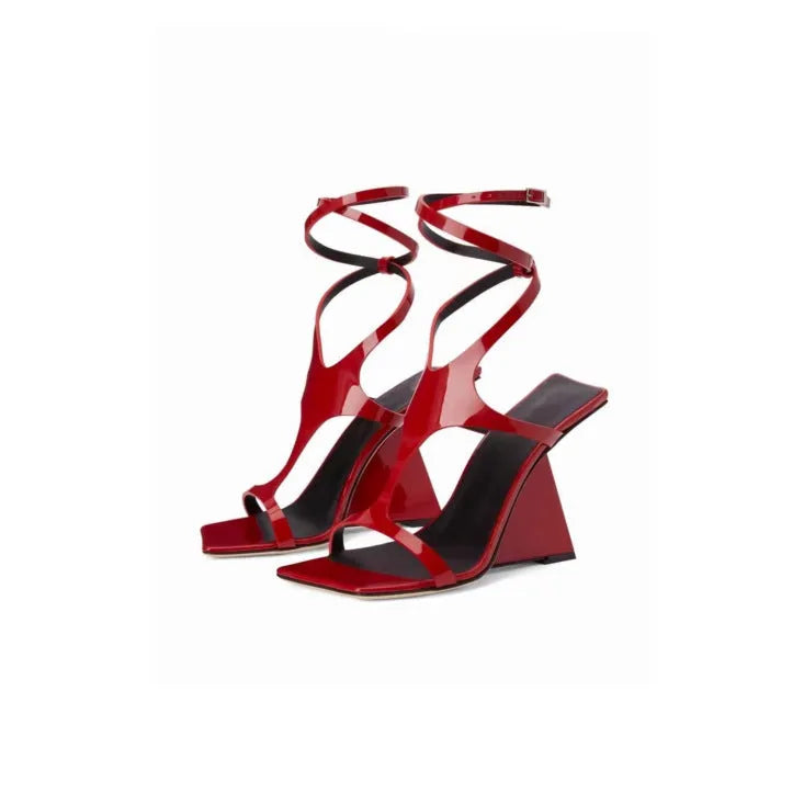 Women's black high heel sandals with square toe and button fastening on a 9.5cm heel.