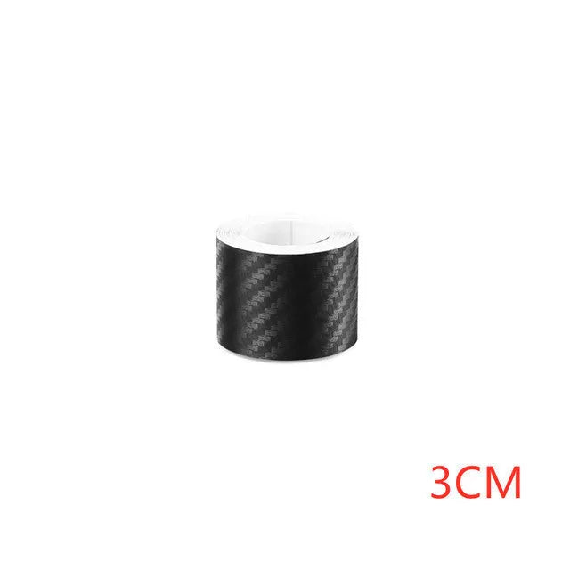 Roll of matte black 3D carbon fibre adhesive protection film for car door sills and bumpers.
