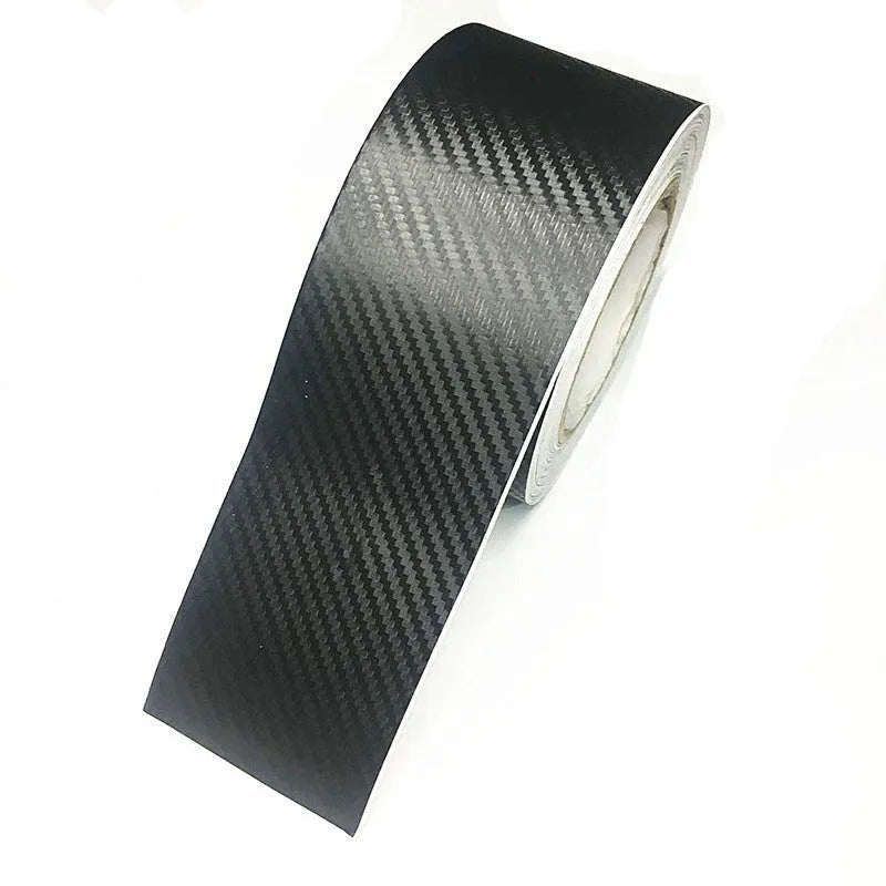 Roll of matte black 3D carbon fibre adhesive protection film for car door sills and bumpers.