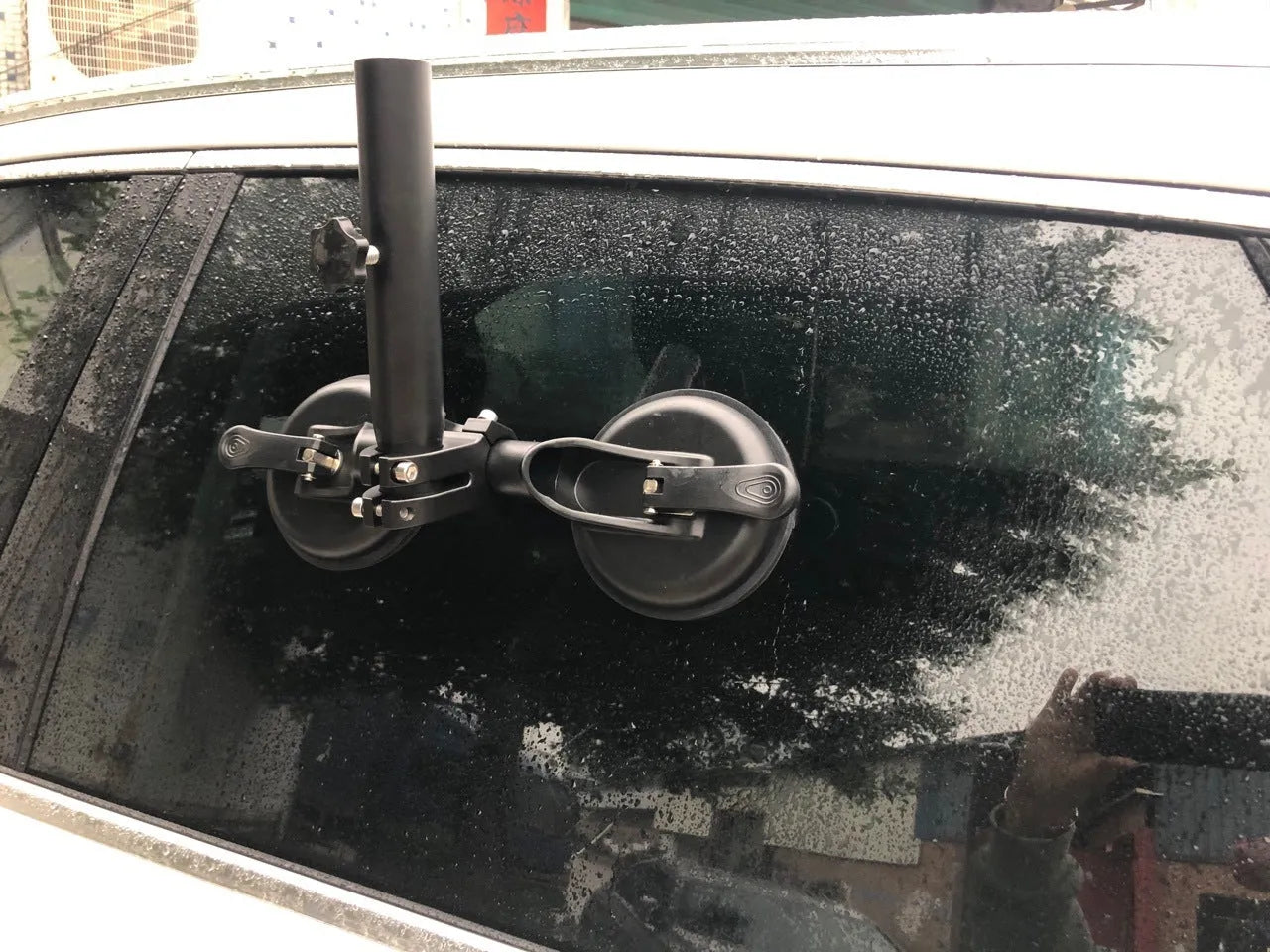 Black off-road car glass sucker mount with round rubber suction cup on ABS plastic base