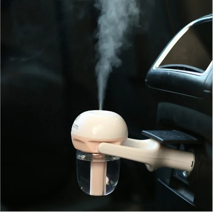 Compact blue car humidifier with 180 degree rotation spray for vehicle air quality improvement