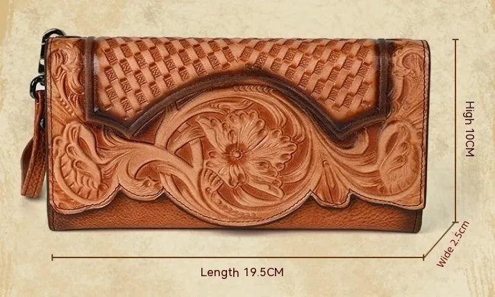 Women's brown tri-fold leather wallet with embossed floral pattern showing interior card slots