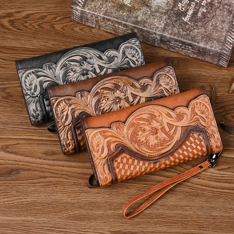 Women's brown tri-fold leather wallet with embossed floral pattern showing interior card slots
