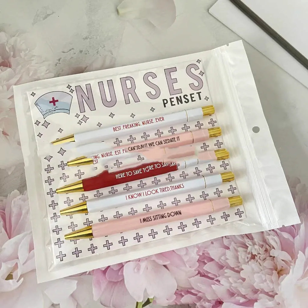 Set of five white nurse theme ballpoint pens with retractable tips.