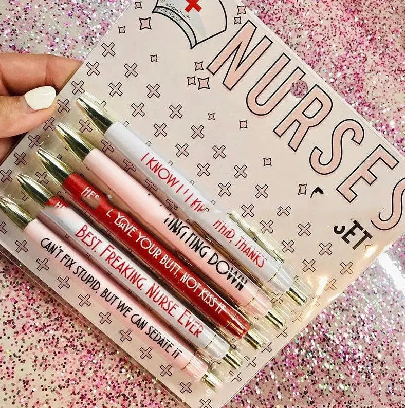 Set of five white nurse theme ballpoint pens with retractable tips.