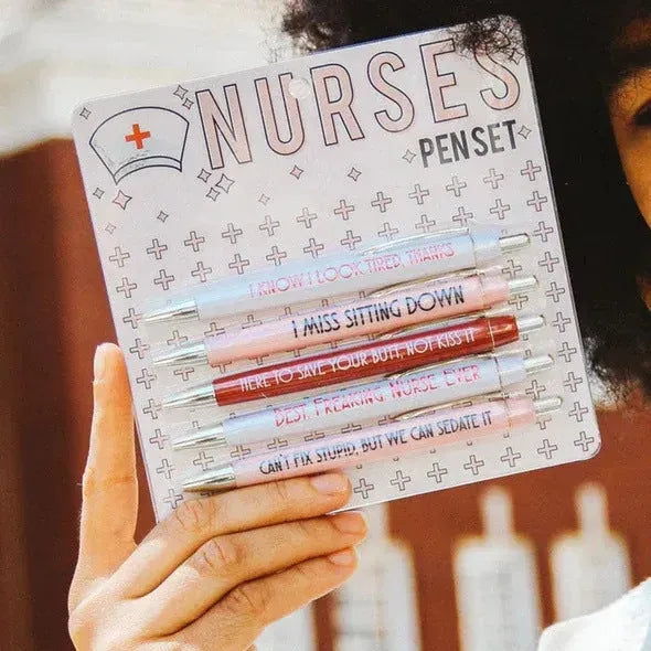 Set of five white nurse theme ballpoint pens with retractable tips.