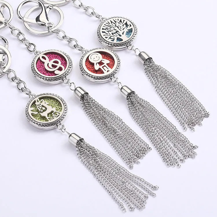Alloy tassel car pendant with long chain hanging, showing decorative box detail.
