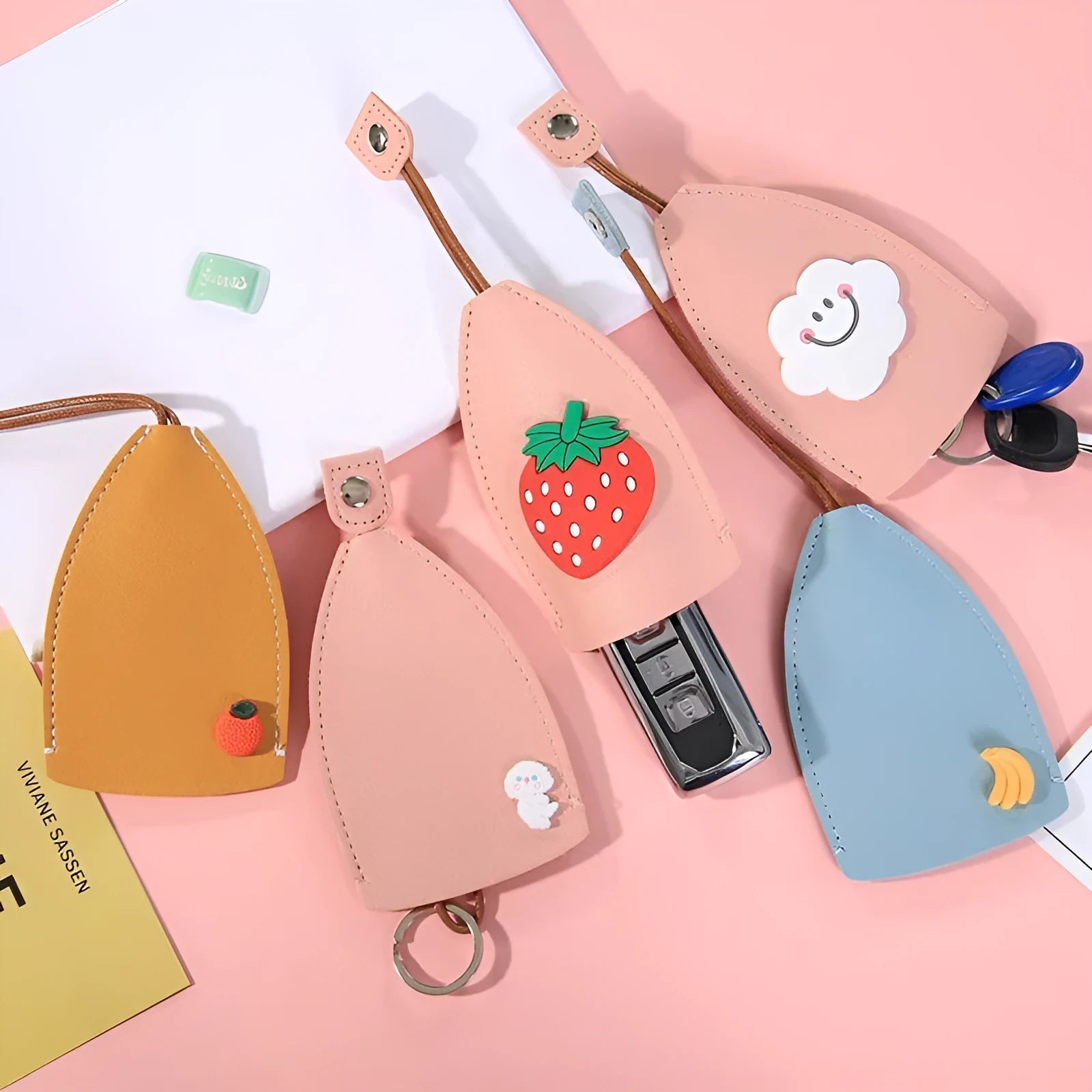 Cartoon PU leather pull-out car key case measuring 14 x 7.5cm with colourful designs